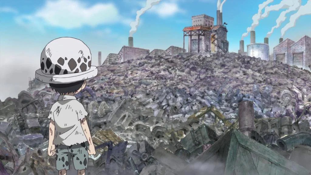 Trafalgar Law bambino davanti alle macerie e agli impianti distrutti di Flevance.